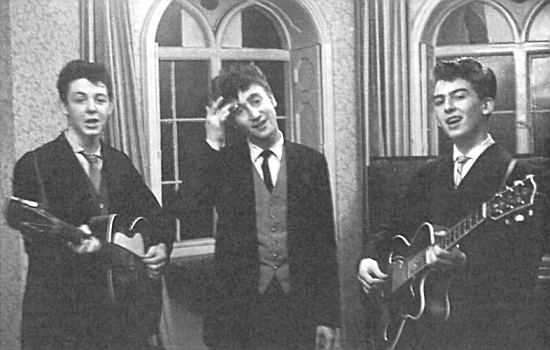 Paul, John and George playing after the wedding of George's brother, Harry