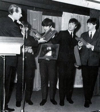 The Beatles are presented with awards